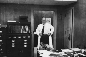 1950s in the door of his office in the Stadium in a white coat.